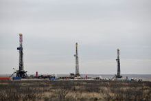 FILE PHOTO: Drilling rigs operate in the Permian Basin oil and natural gas production area in Lea County, New Mexico, U.S., February 10, 2019. Picture taken February 10, 2019.    REUTERS/Nick Oxford/File Photo