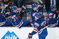 United States' Mackie Samoskevich (11) celebrates his goal against Slovakia with his teammates during first period IIHF World Junior Hockey Championship action in Red Deer, Alberta on Sunday, December 26, 2021.  THE CANADIAN PRESS/Jonathan Hayward
