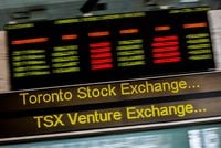 FILE PHOTO: A sign board displaying Toronto Stock Exchange (TSX) stock information is seen in Toronto June 23, 2014.  Canada's main stock index was little changed on Monday as weakness in financial and energy shares offset gains in the materials sector.   REUTERS/Mark Blinch (CANADA - Tags: BUSINESS)/File Photo
